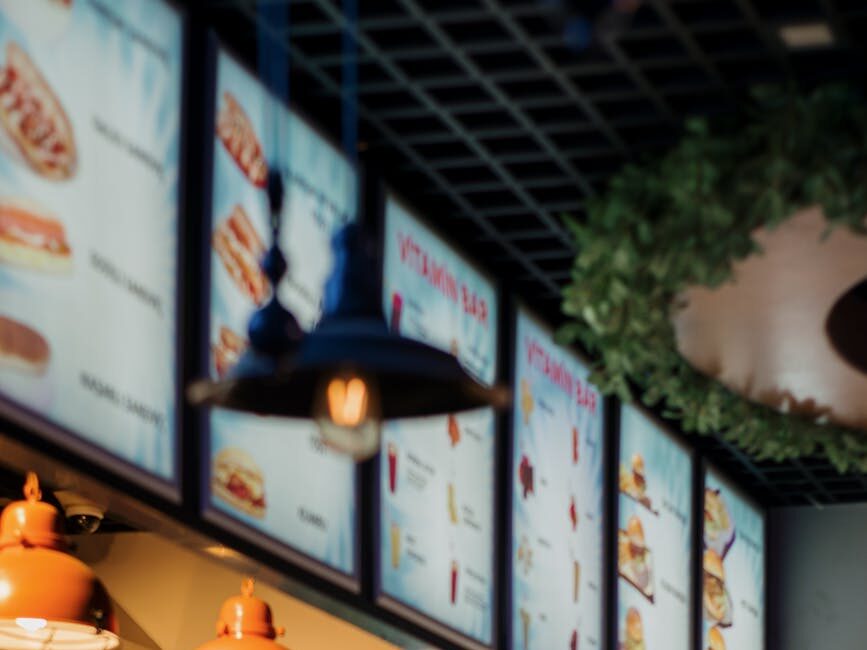 view of the counter and menu boards in a restaurant